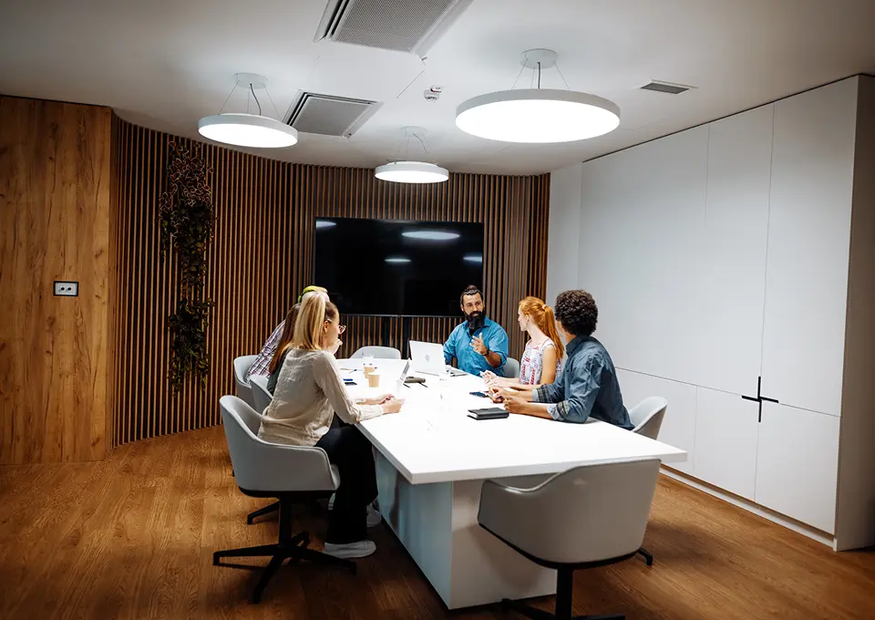 Colleagues collaborating in a bright meeting space